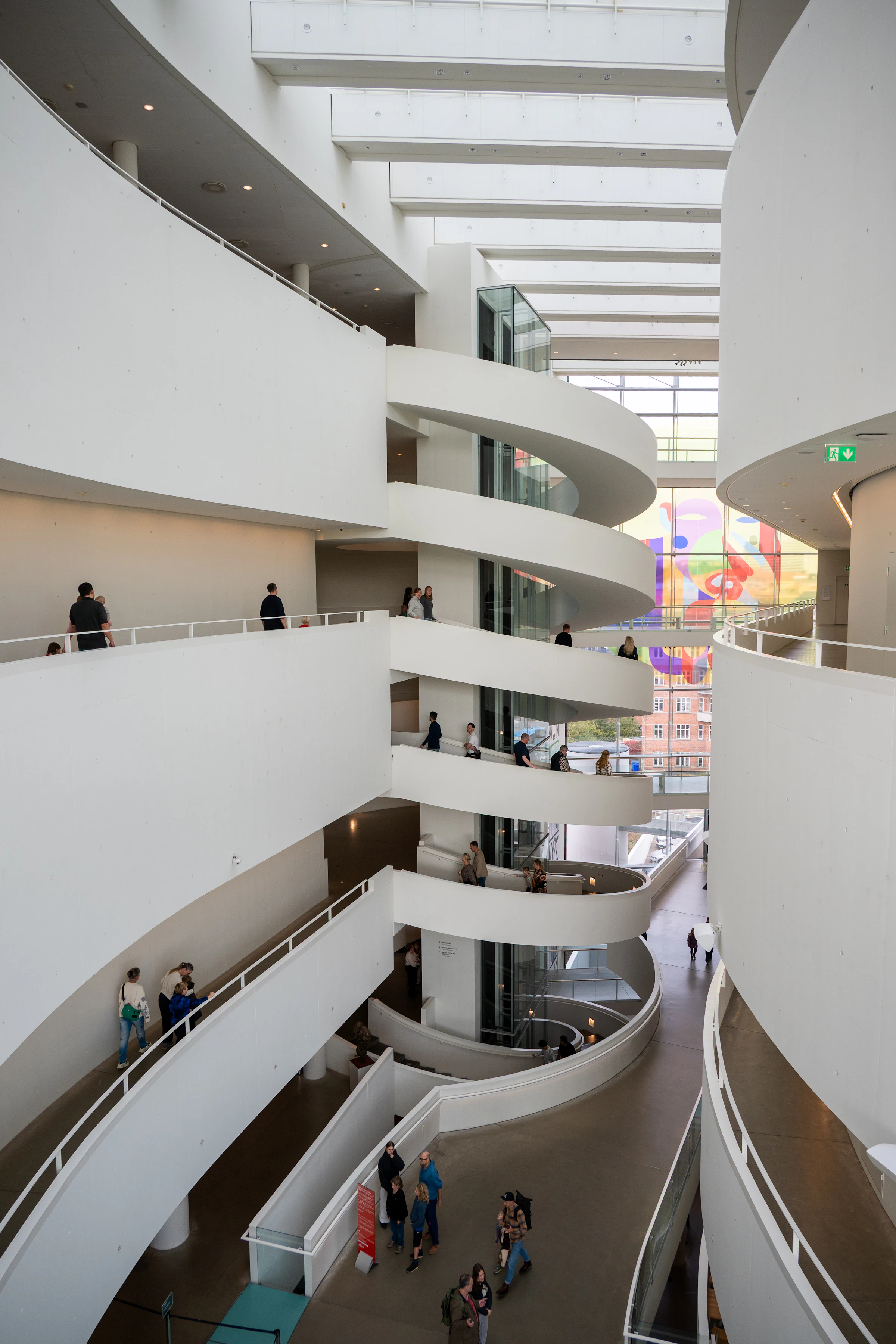 Modern museum interior with spiraling ramps and central atrium